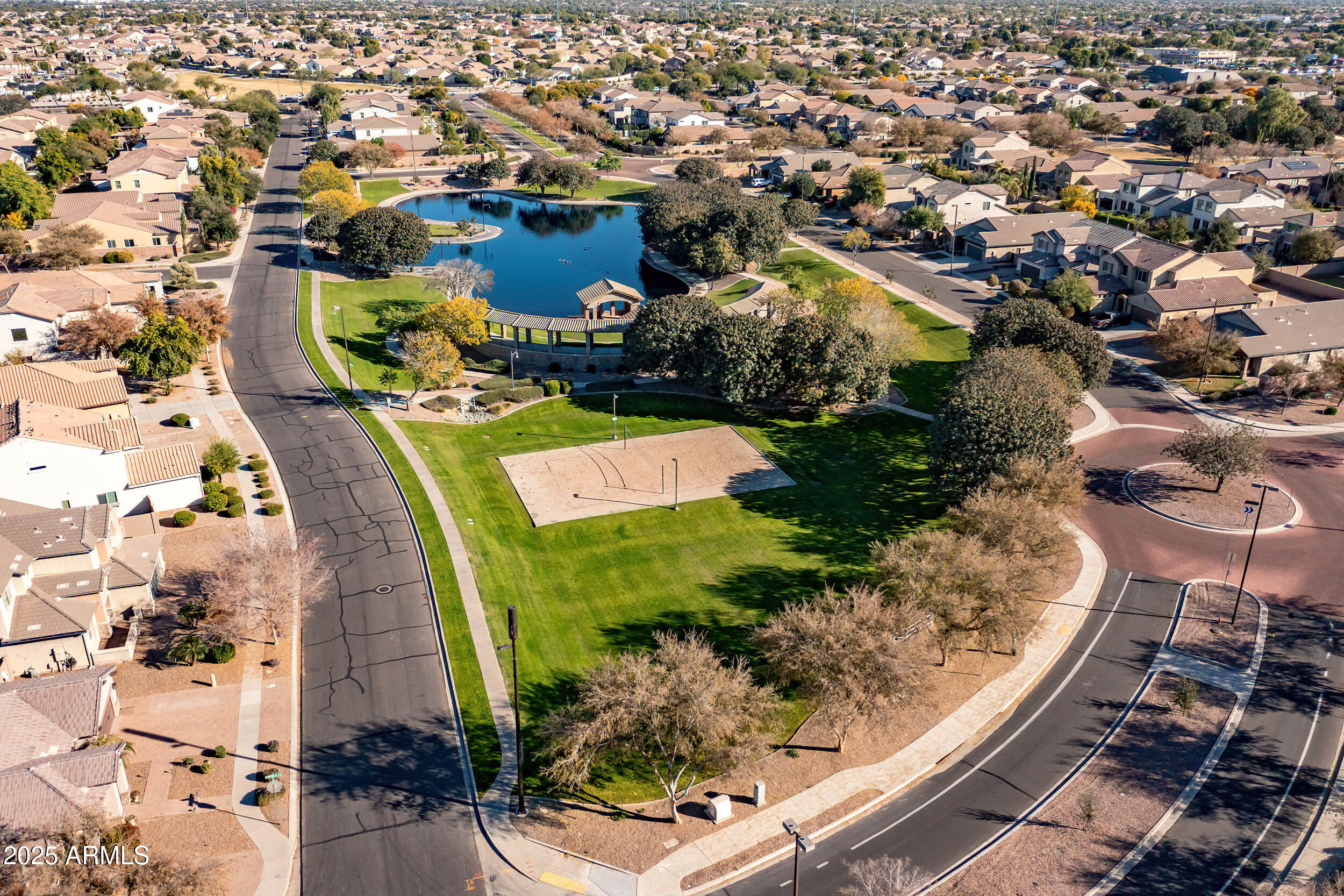 2955 East Blue Sage Road Gilbert, AZ 85297 - Photo 52 of 55 an aerial view of residential houses with outdoor space