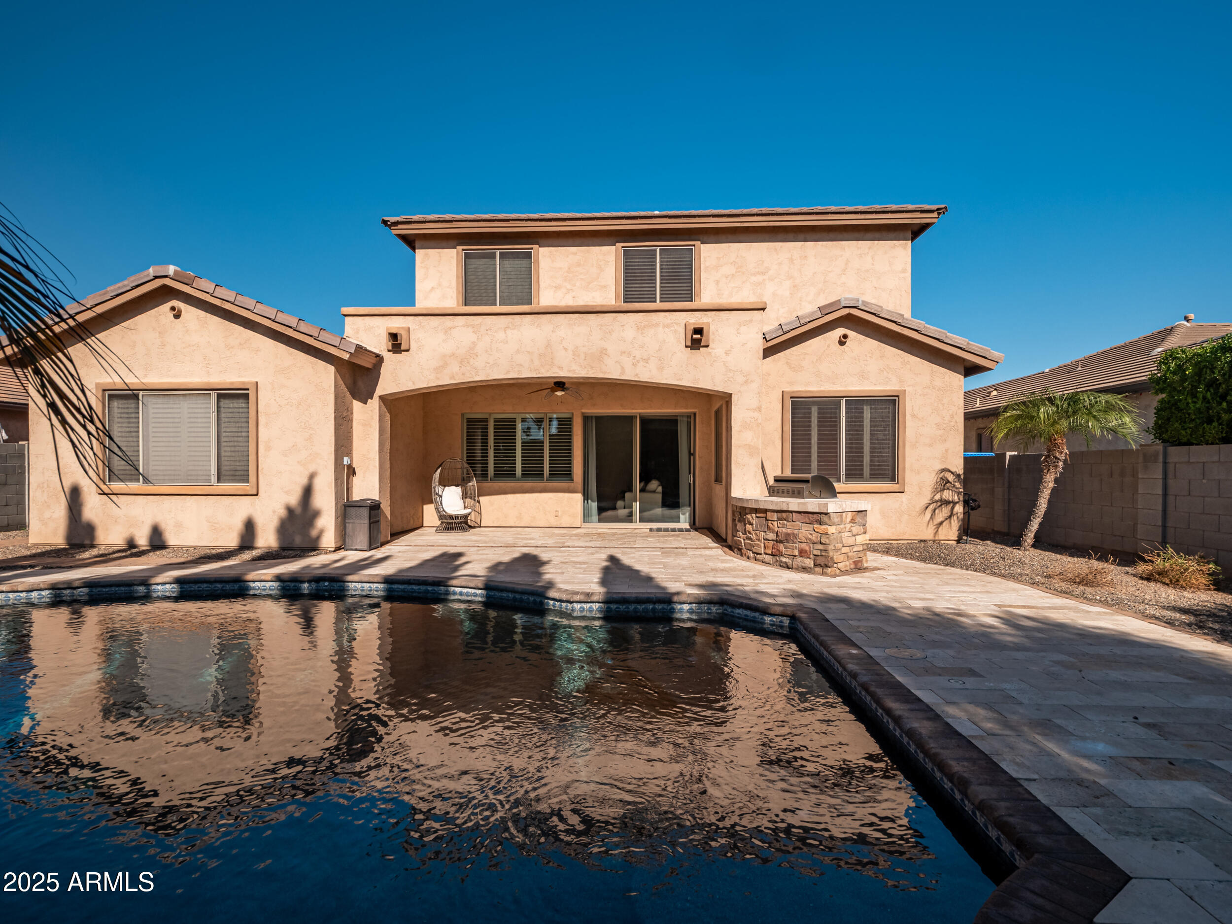 2955 East Blue Sage Road Gilbert, AZ 85297 - Photo 10 of 55 a view of a house with pool and chairs