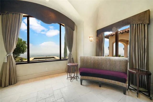 a spacious bathroom with a tub sink and mirror