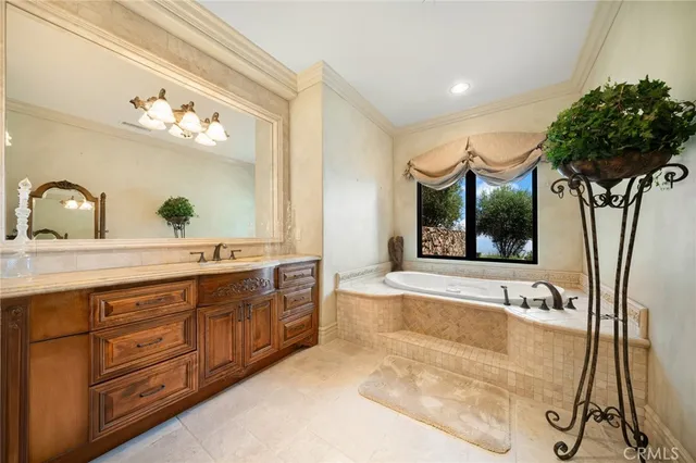 a spacious bathroom with a granite countertop sink a large mirror and a shower