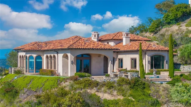 a view of a brick house with a yard