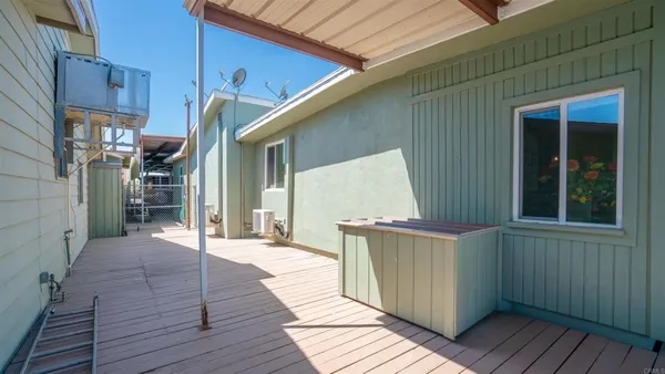 a kitchen with granite countertop cabinets sink and window
