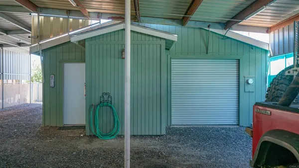 a living room with furniture a flat screen tv and a window