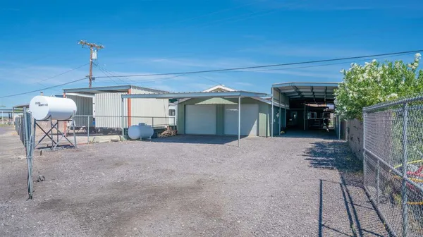 a bedroom with a bed and a night stand