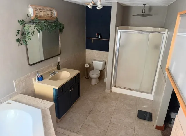 a bathroom with a double vanity sink and mirror