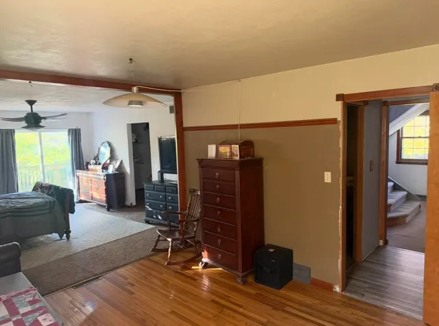 a view of a livingroom with furniture and gym equipment