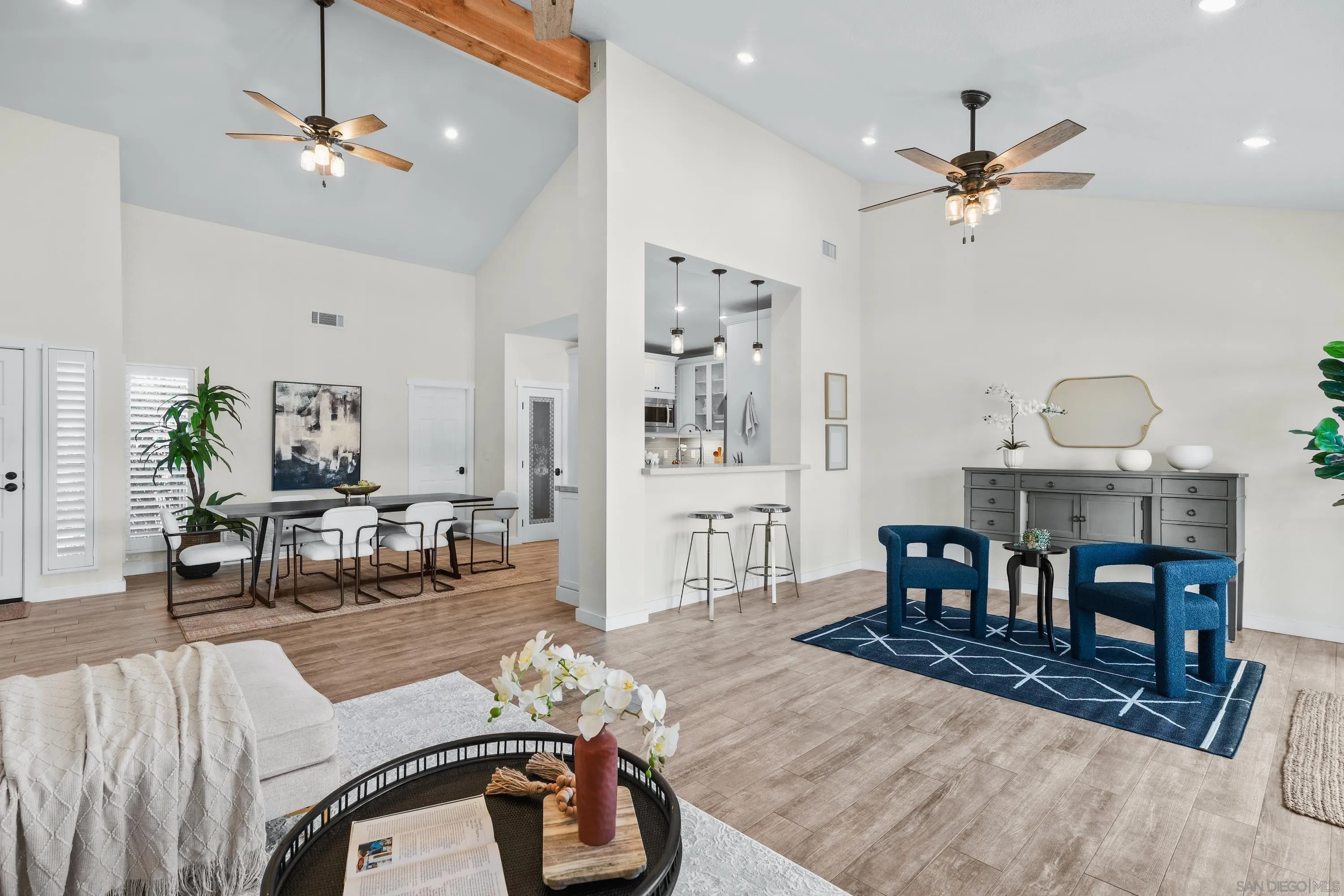10472 Cadwell Road Santee, CA 92071 - Photo 12 of 30 a living room with furniture a fireplace and a chandelier