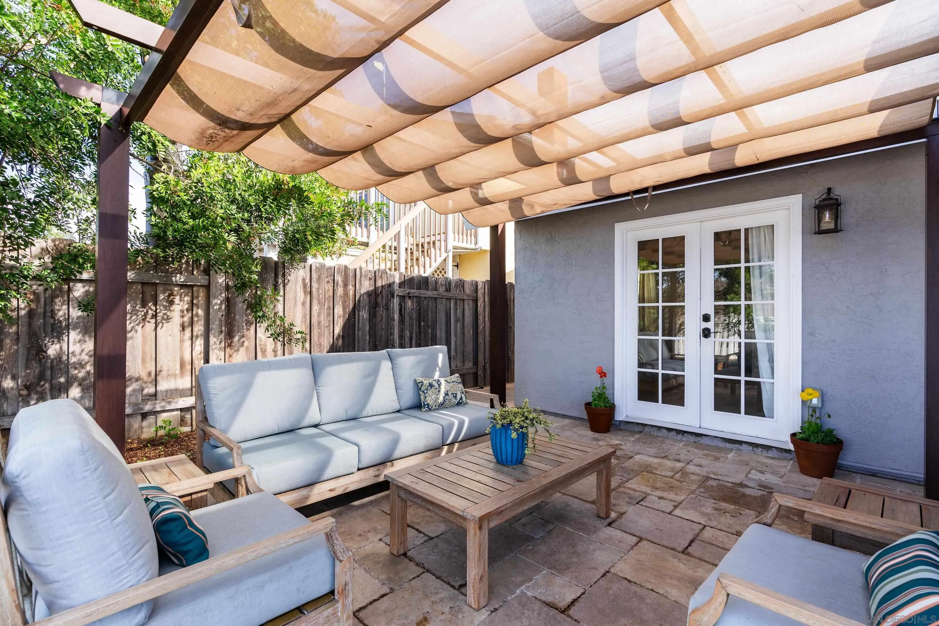 10472 Cadwell Road Santee, CA 92071 - Photo 17 of 30 a outdoor space with patio the couches and a dining table with the garden view
