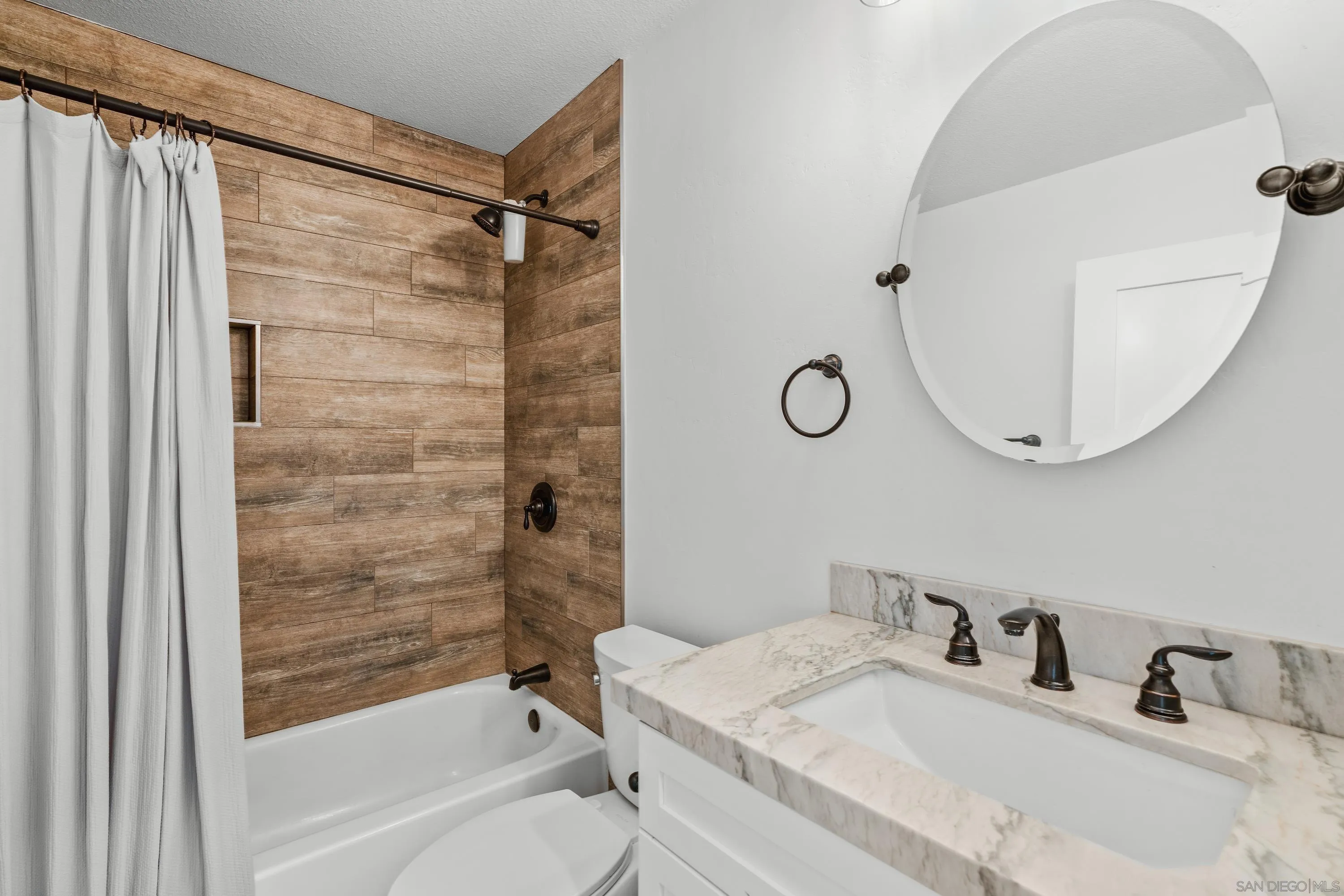 10472 Cadwell Road Santee, CA 92071 - Photo 27 of 30 a bathroom with a sink and a mirror
