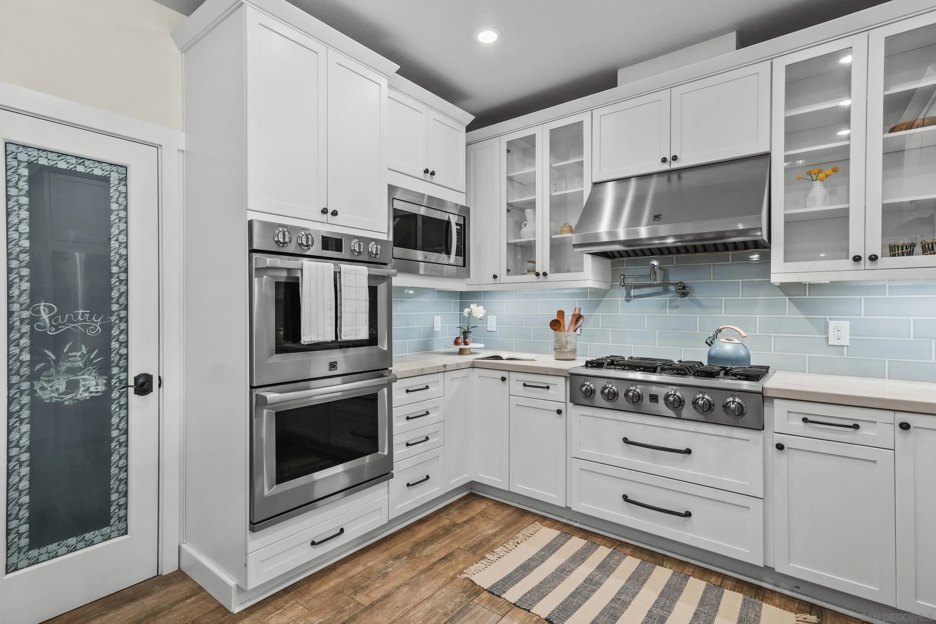 10472 Cadwell Road Santee, CA 92071 - Photo 5 of 30 a kitchen with stainless steel appliances granite countertop a stove and cabinets