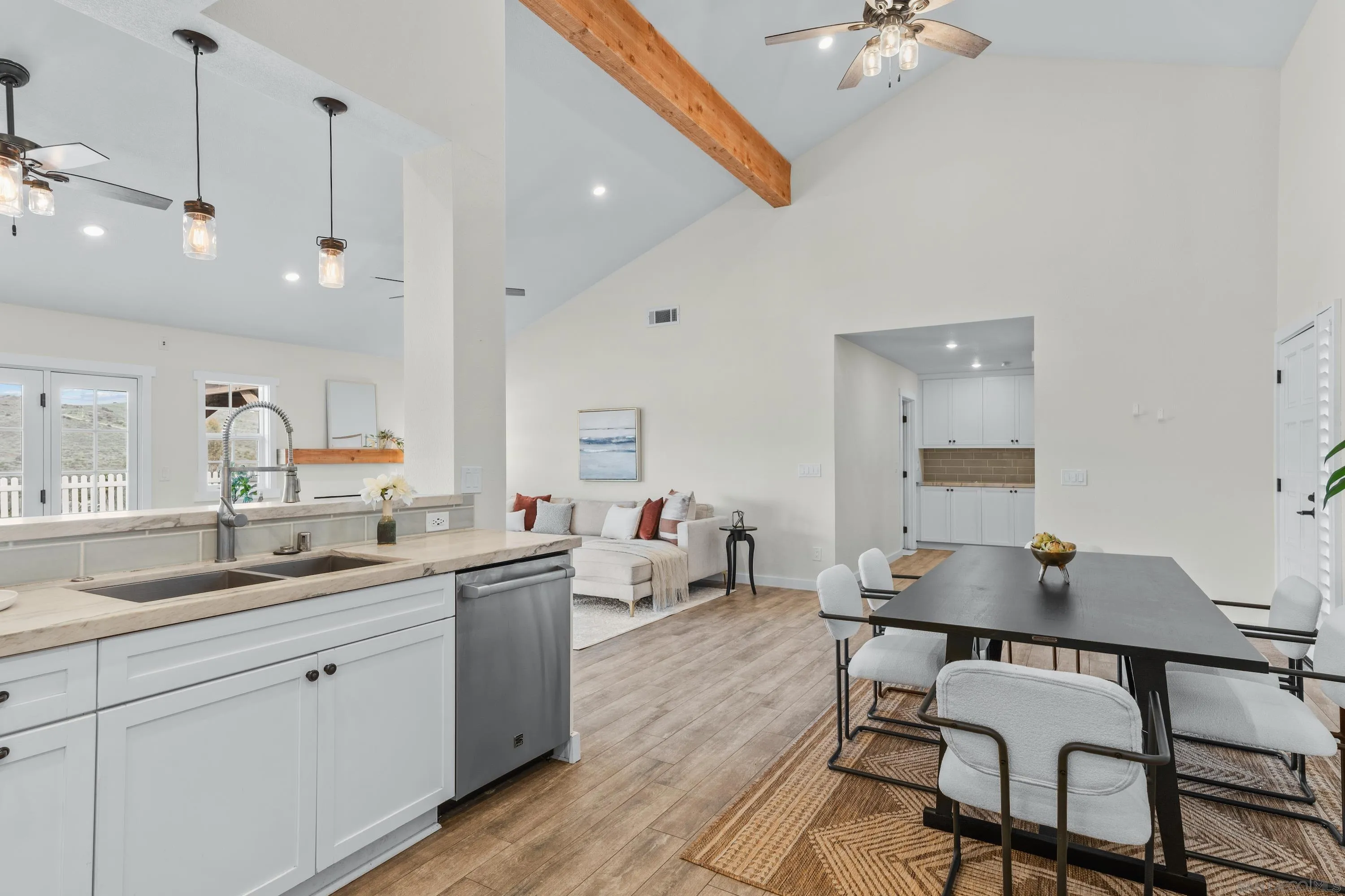10472 Cadwell Road Santee, CA 92071 - Photo 9 of 30 a kitchen with a sink cabinets and wooden floor