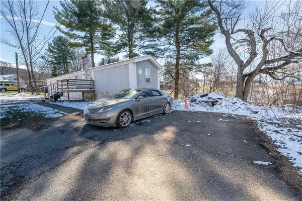 a car parked in front of a house