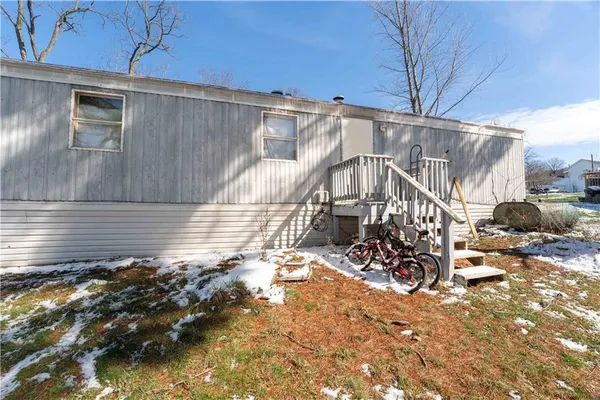 a view of a backyard with sitting area