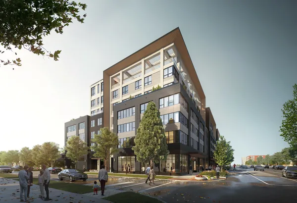 a view of a tall building next to a road