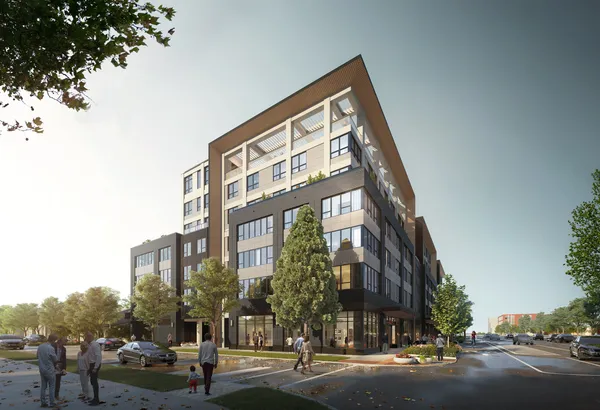 a view of a tall building next to a road