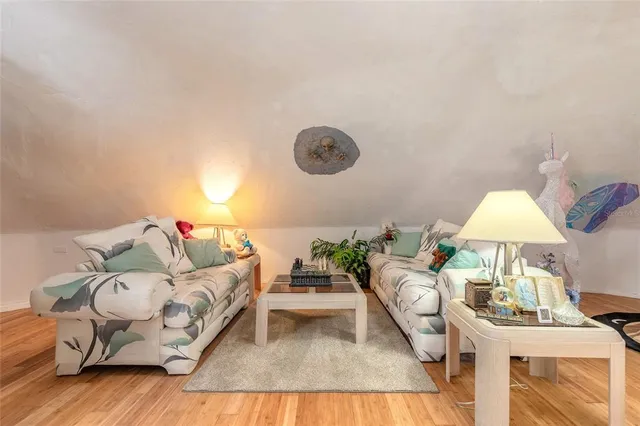 a living room with furniture and a lamp