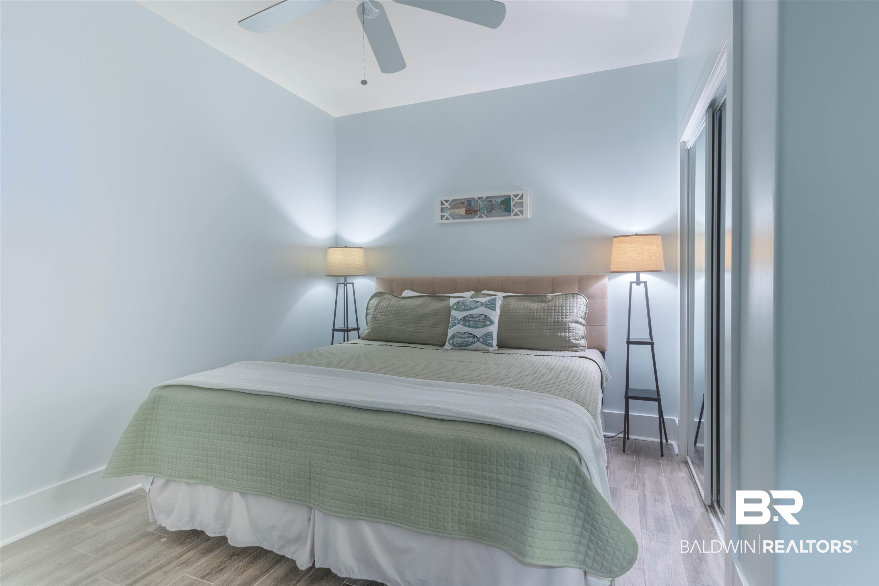 28107 Perdido Beach Boulevard, Unit D714 Orange Beach, AL 36561 - Photo 37 of 88 Bedroom with a ceiling fan, baseboards, and wood finished floors
