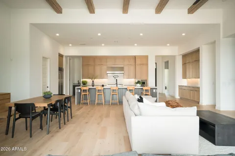 a kitchen with kitchen island cabinets and chairs in it