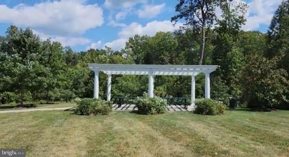 17854 Meriwether Lewis Street Ruther Glen, VA 22546 - Photo 29 of 35 front view of a house with a garden