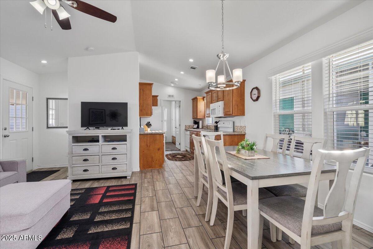 8865 East Baseline Road, Unit 1232 Mesa, AZ 85209 - Photo 10 of 38 a large kitchen with a table and chairs in it