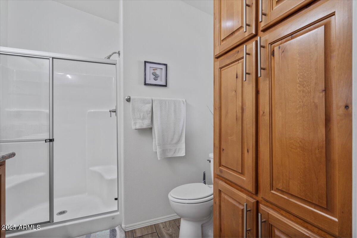 8865 East Baseline Road, Unit 1232 Mesa, AZ 85209 - Photo 15 of 38 a bathroom with a shower toilet and sink