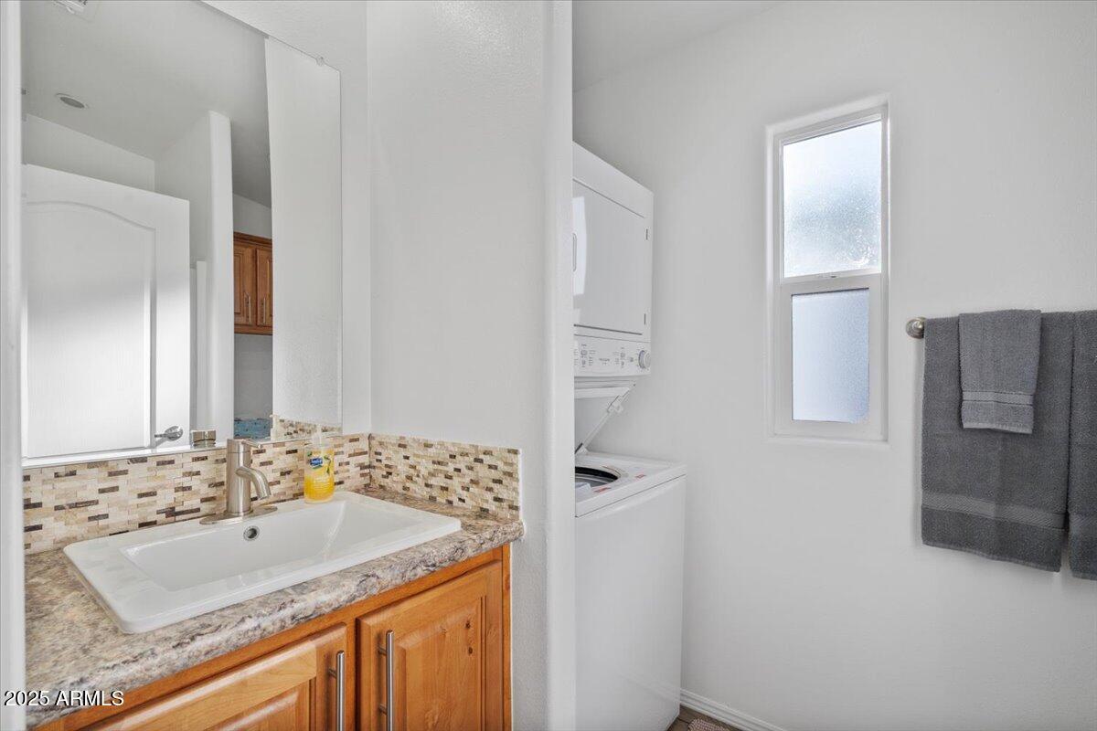 8865 East Baseline Road, Unit 1232 Mesa, AZ 85209 - Photo 19 of 38 a bathroom with a sink and a mirror