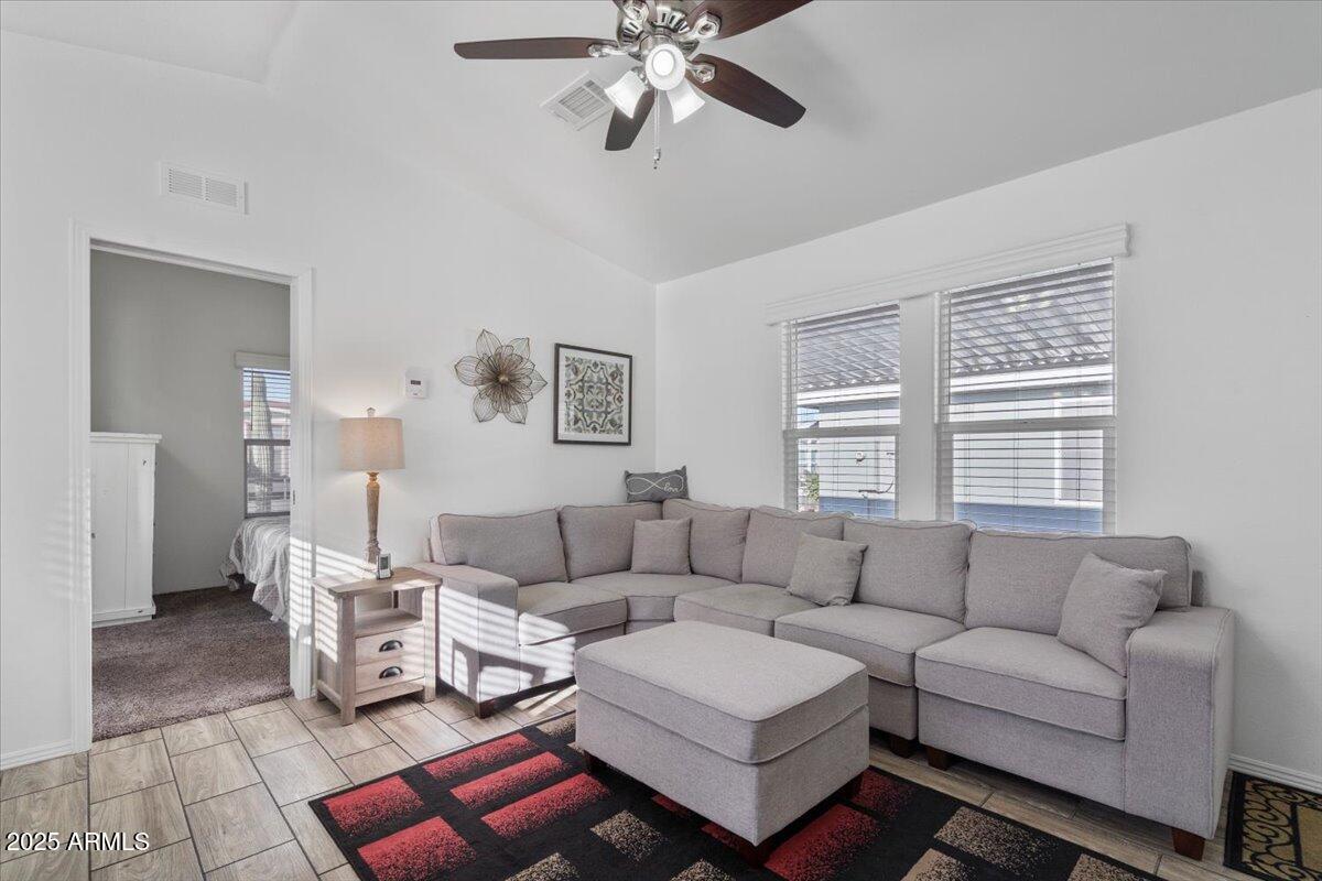 8865 East Baseline Road, Unit 1232 Mesa, AZ 85209 - Photo 2 of 38 a living room with furniture and a window