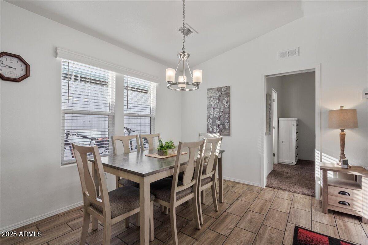 8865 East Baseline Road, Unit 1232 Mesa, AZ 85209 - Photo 3 of 38 a view of a dining room with furniture and window