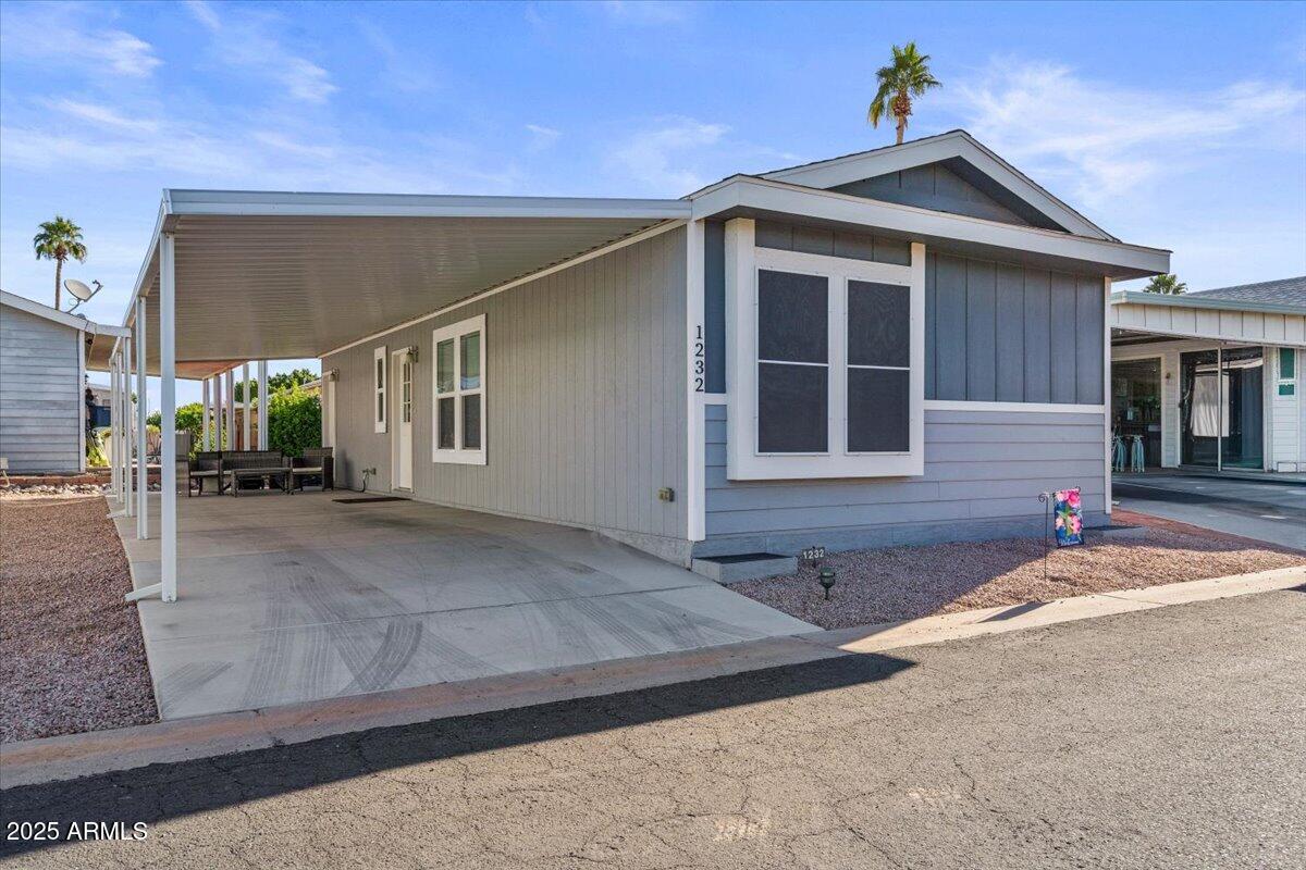 8865 East Baseline Road, Unit 1232 Mesa, AZ 85209 - Photo 6 of 38 a house view with a outdoor space