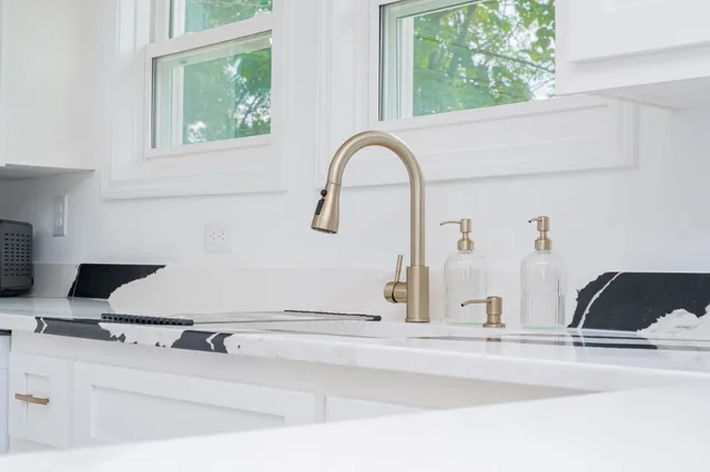 a view of two sink and a window