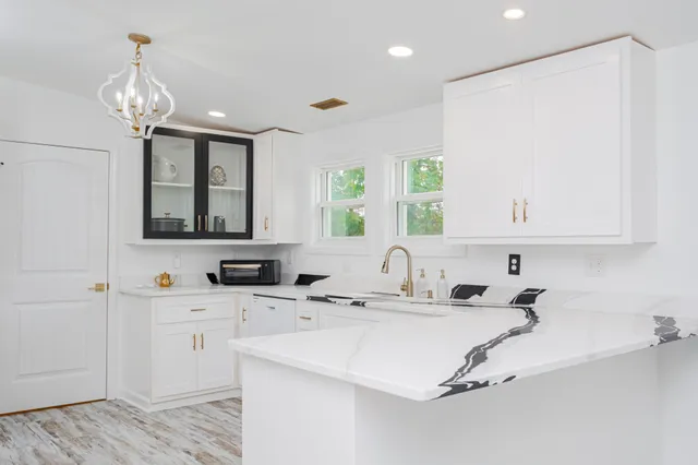a bathroom with a sink a vanity and a mirror