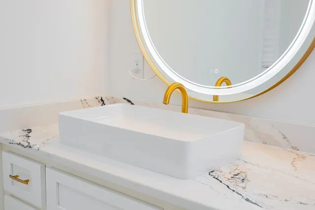 a bathroom with a sink and a mirror