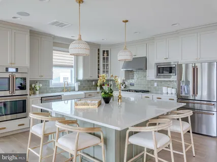a living room with furniture fireplace and a large window