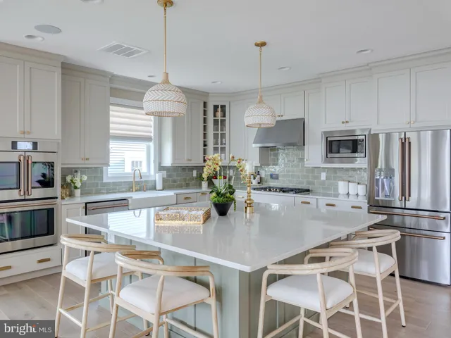 a living room with furniture fireplace and a large window