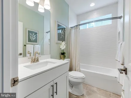 a bedroom with bed and window