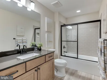 a spacious bedroom with a bed and a couch