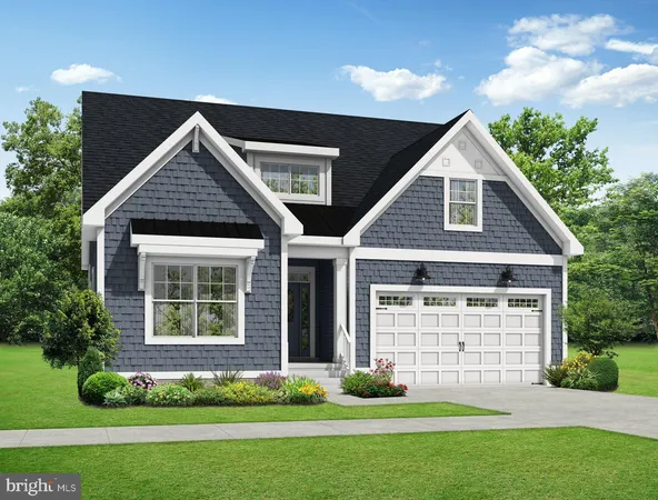 a front view of a house with a garden and yard