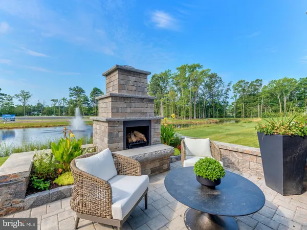 a view of a porch with furniture and a fire pit