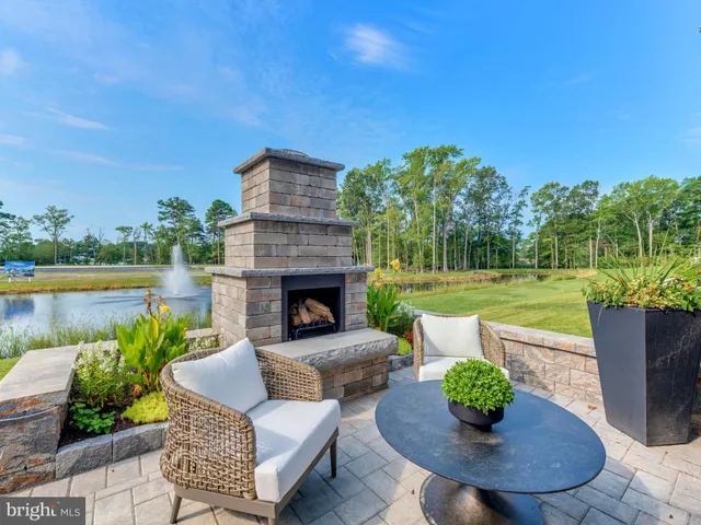 a view of a porch with furniture and a fire pit