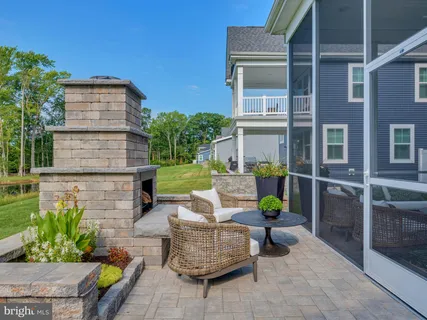 a swimming pool with potted plants and big yard