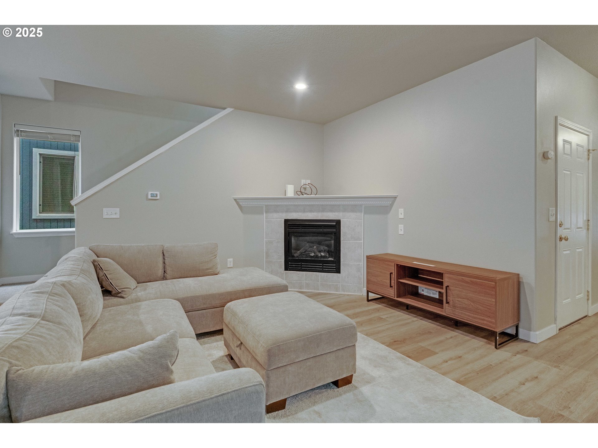 17670 Southwest September Lane Beaverton, OR 97003 - Photo 6 of 34 a living room with furniture and a fireplace