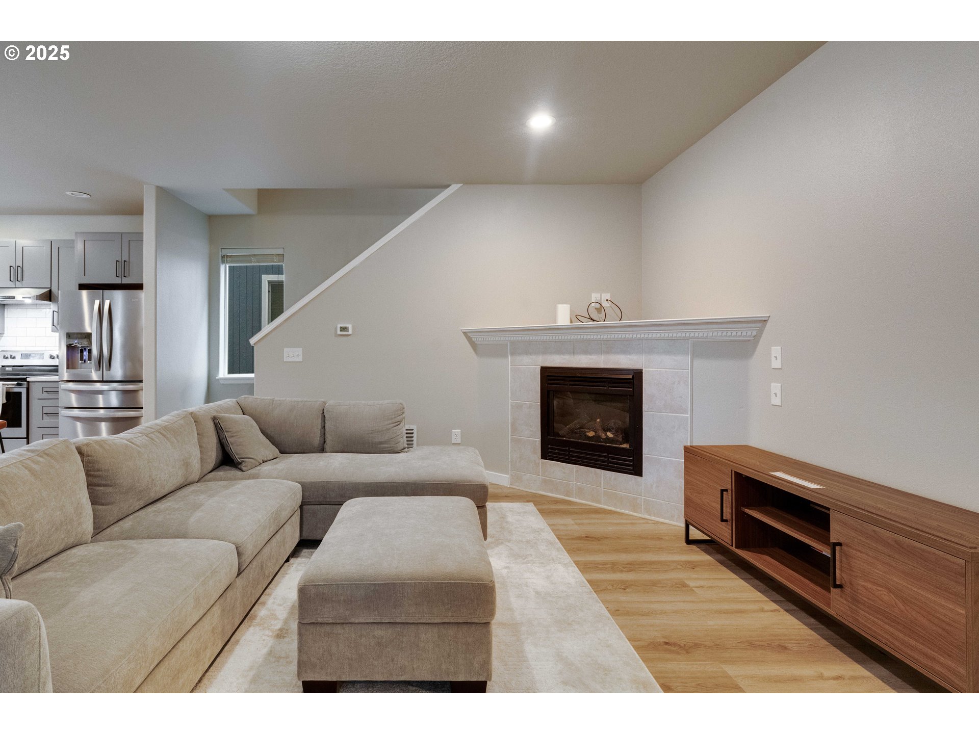 17670 Southwest September Lane Beaverton, OR 97003 - Photo 8 of 34 a living room with furniture and a fireplace