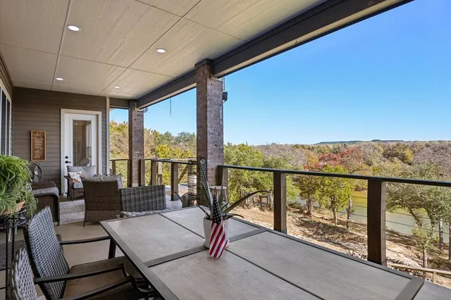 a view of trees from a balcony