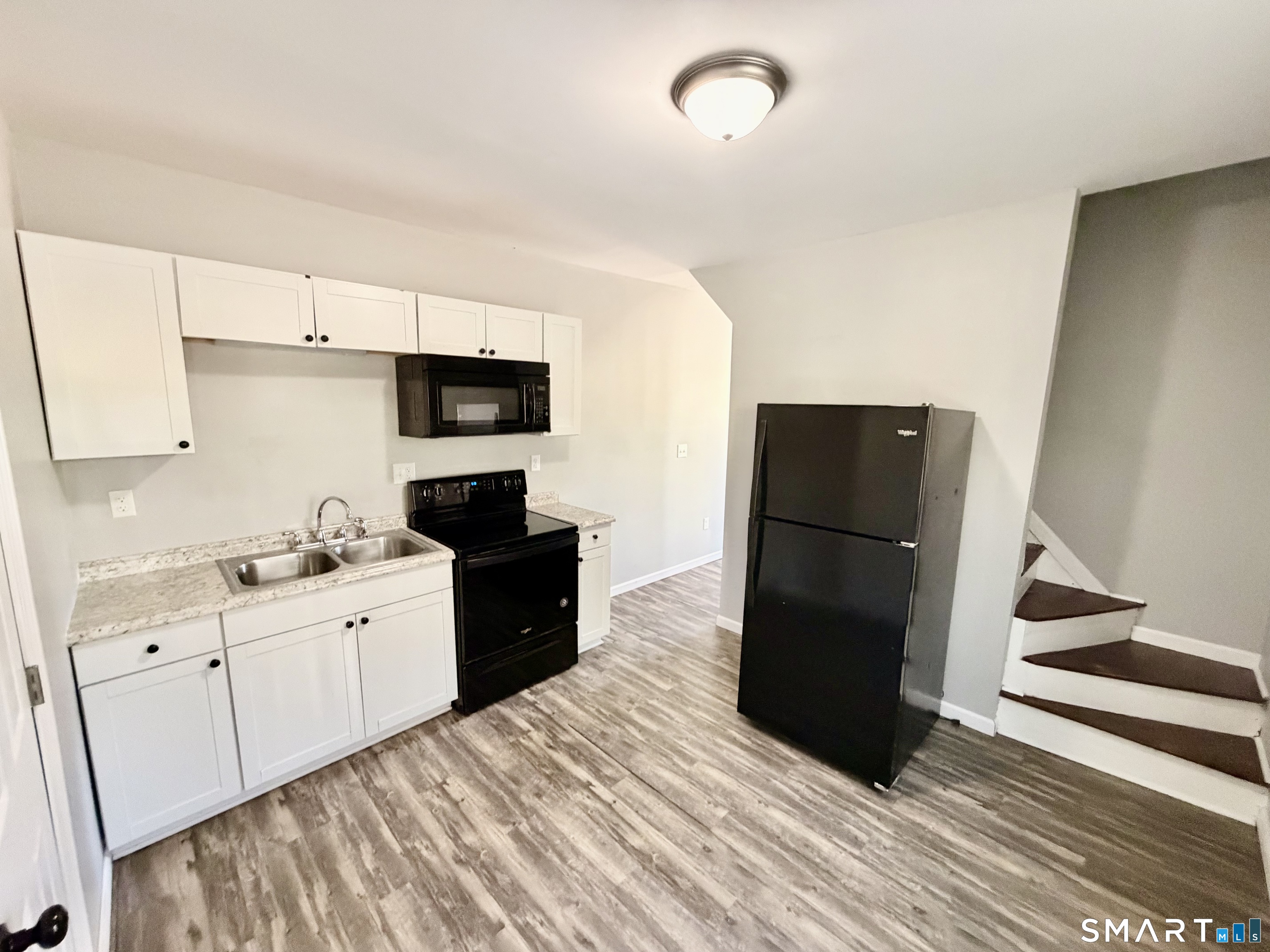 151 West Center Street Southington, CT 06489 - Photo 1 of 11 a kitchen with a refrigerator and a stove