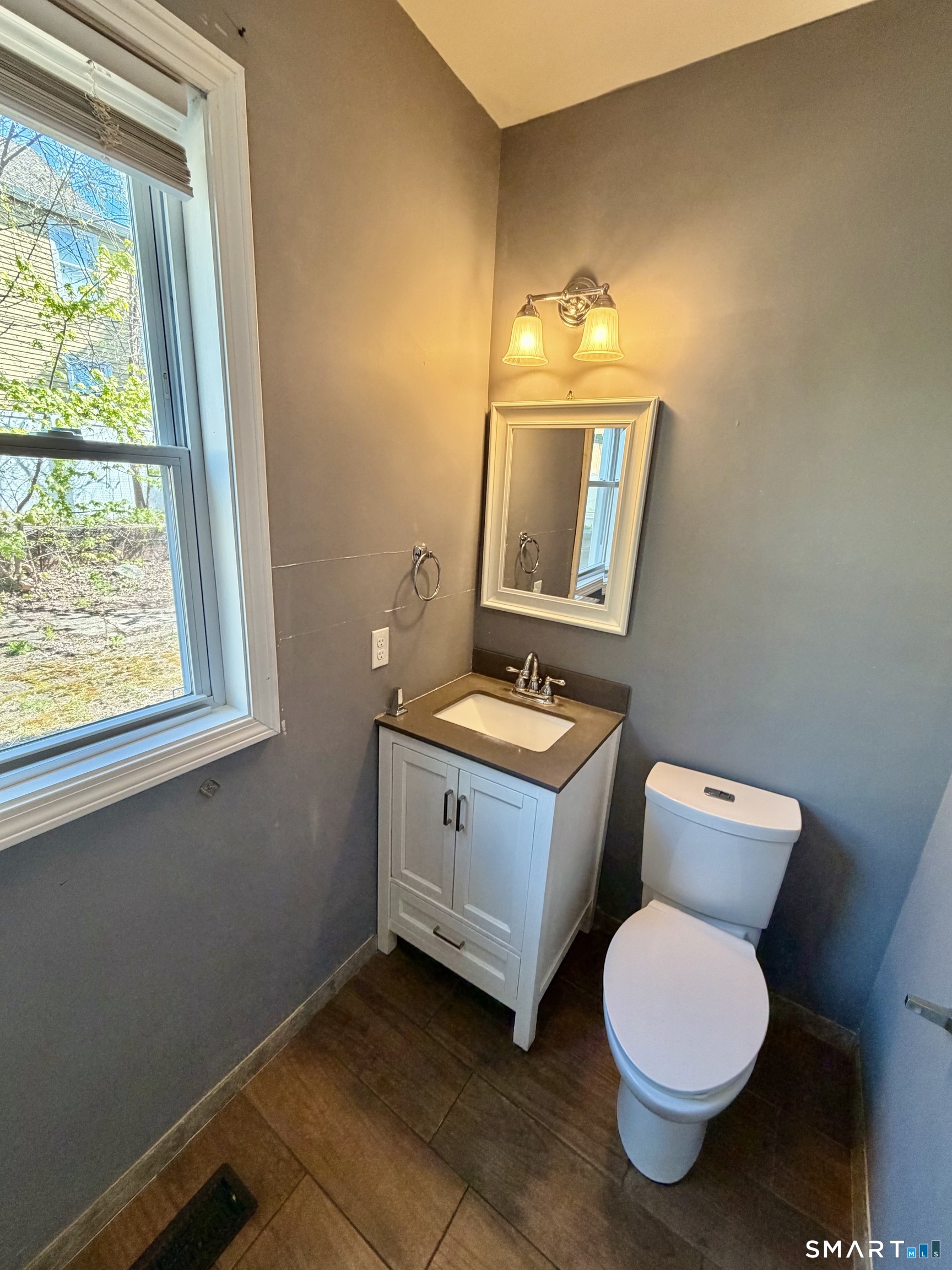151 West Center Street Southington, CT 06489 - Photo 6 of 11 a bathroom with a toilet sink and mirror