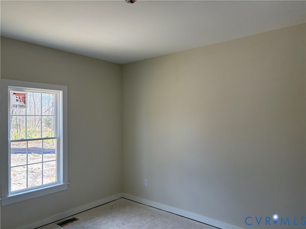 15085 Lebanon Road Disputanta, VA 23842 - Photo 11 of 17 an empty room with a window