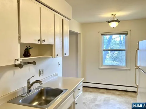 a bathroom with a sink and a large mirror