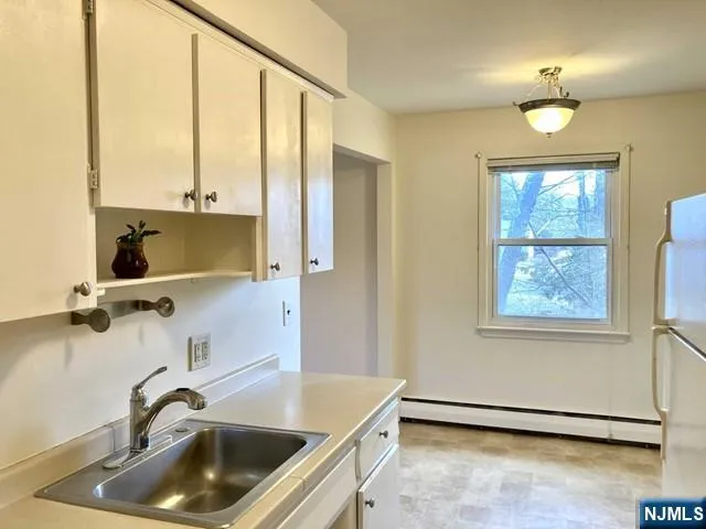 a bathroom with a sink and a large mirror