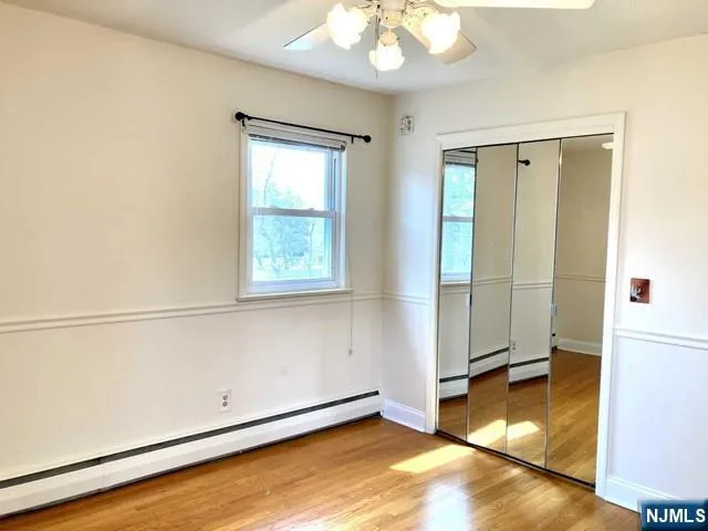 a view of a livingroom with wooden floor