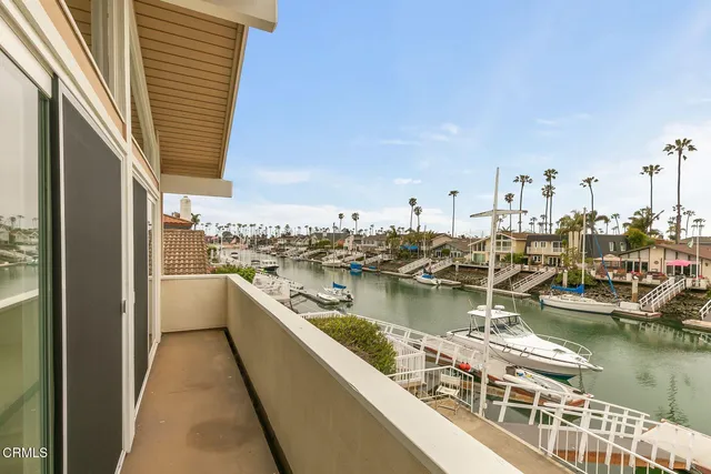 a kitchen with granite countertop white cabinets and a window